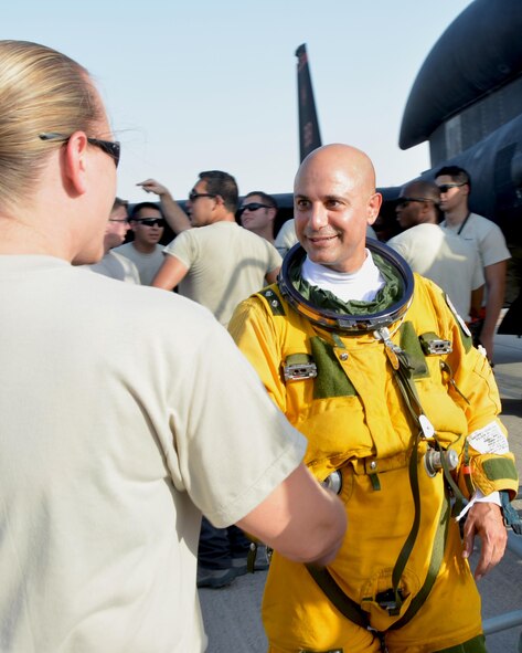 Lt. Col. Ralph, 99th Expeditionary Reconnaissance Squadron U2 pilot, greets a maintainer after exiting the cockpit of a U2 in an undisclosed location, Sep. 10, 2016. Ralph is the fifth U2 pilot currently serving to reach a career milestone of 2,000 flying hours. (U.S. Air Force photo by Staff. Sgt. Samantha Mathison)