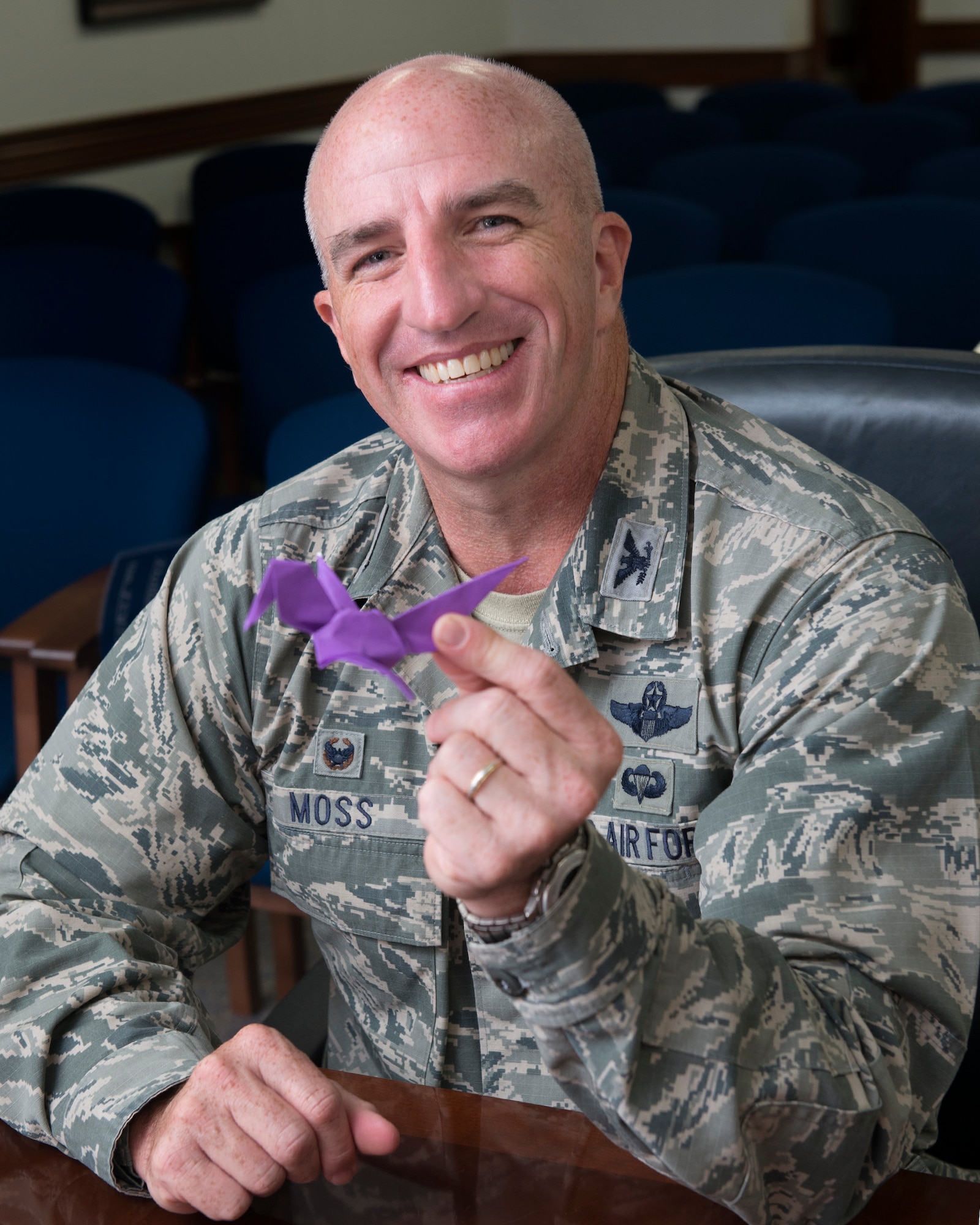 Col. Kenneth Moss, 374th Airlift Wing commander, shows his work after complete folding an origami crane at Yokota Air Base, Japan, Oct. 3, 2016. Yokota’s CFC-O representatives plan to collect 1,000 origami cranes to grant a symbolic wish. (U.S. Air Force photo by Yasuo Osakabe/Released) 