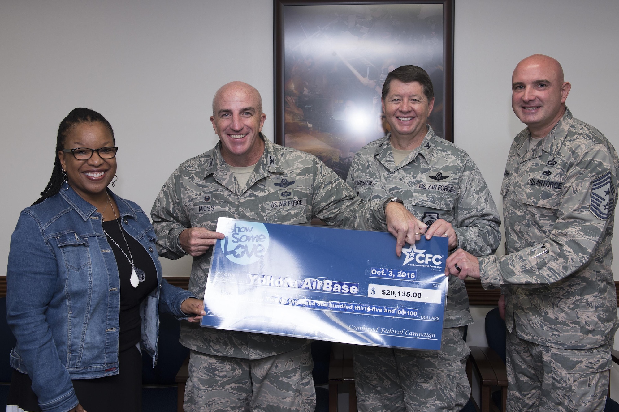 The 374th Airlift Wing leadership hold a check for the Combined Federal Campaign-Overseas during the 2016 CFC-O kickoff at Yokota Air Base, Japan, Oct. 3, 2016. During the 2015 campaign, the men and women of Yokota raised more than $205,981.61 for charities through the CFC-O. (U.S. Air Force photo by Yasuo Osakabe/Released) 