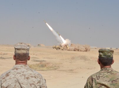 Lt. Gen Stephen J. Townsend, commander of Combined Joint Task Force – Operation Inherent Resolve, and Col. Paul Nugent, commander of Task Force Al Asad, observe a High Mobility Artillery Rocket System strike that destroyed a building housing Da’esh (an Arabic acronym for ISIL) fighters near Haditha, Iraq, Sept. 7, 2016. Combined Joint Task Force-Operation Inherent Resolve is a multinational effort to weaken and destroy Islamic State in Iraq and the Levant operations in the Middle East region and around the world. 