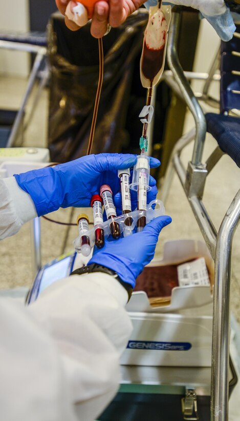 U.S. Army Staff Sgt. Princess Sandford, C Company, Landstuhl Regional Medical Center medical laboratory technician, collects samples from a blood donor during an Armed Services Blood Drive-Europe blood drive at the Kaiserslautern Military Community Center, Sept. 20, 2016. The ASBP-Europe team uses the collected blood samples to test donations for blood types, antibodies, diseases and other abnormalities to ensure a recipient of the donation receives the best possible match. (U.S. Air Force photo by Staff Sgt. Timothy Moore)