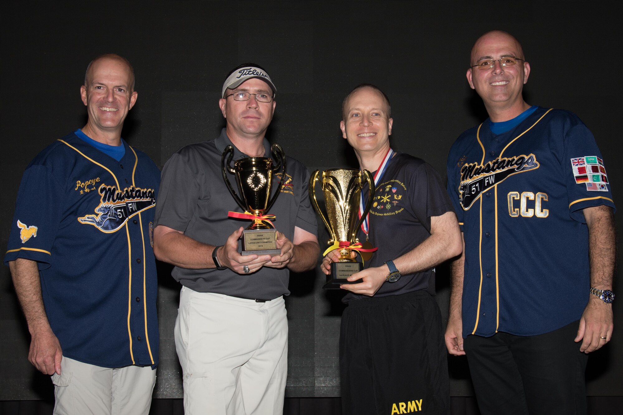 U.S. Air Force Col. Andrew Hansen, 51st Fighter Wing commander, and Chief Master Sgt. Alexander Del Valle, right, 51st FW command chief, pose for a photo with 35th Air Defense Artillery leadership during an awards ceremony for Osan Cup 2016 at Osan Air Base, Republic of Korea, Sept. 30, 2016. The U.S. Army’s 35th ADA took first place in the competition by participating in sports such as softball, basketball and bowling. (U.S. Air Force photo by Senior Airman Dillian Bamman)