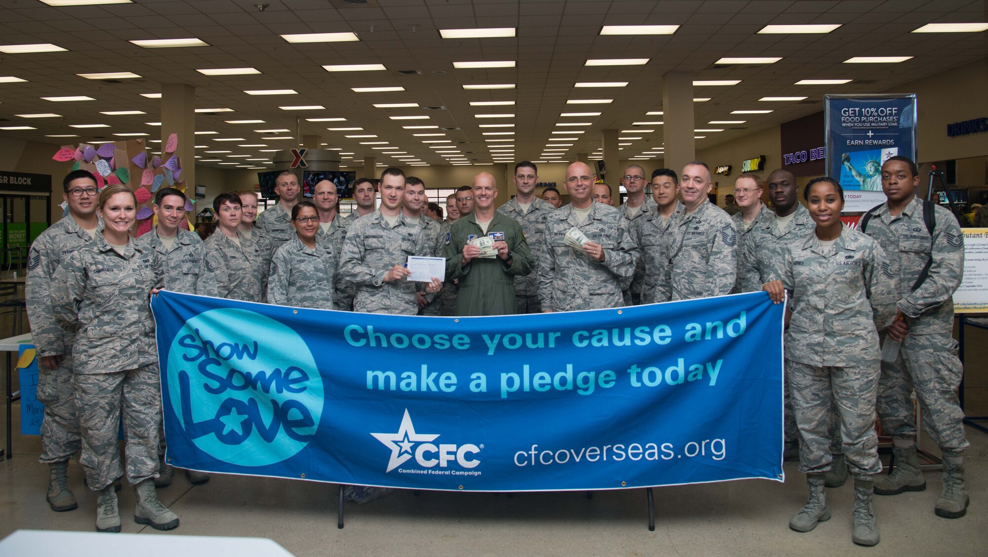 Leadership and volunteers from the 51st Fighter Wing pose for a group photo during the Combined Federal Campaign 2016 kickoff at Osan Air Base, Republic of Korea, Oct. 3, 2016. The CFC is the world’s largest annual workplace charity campaign, with more than 200 CFC campaigns throughout the United States and overseas raising millions of dollars each year. (U.S. Air Force photo by Senior Airman Dillian Bamman)