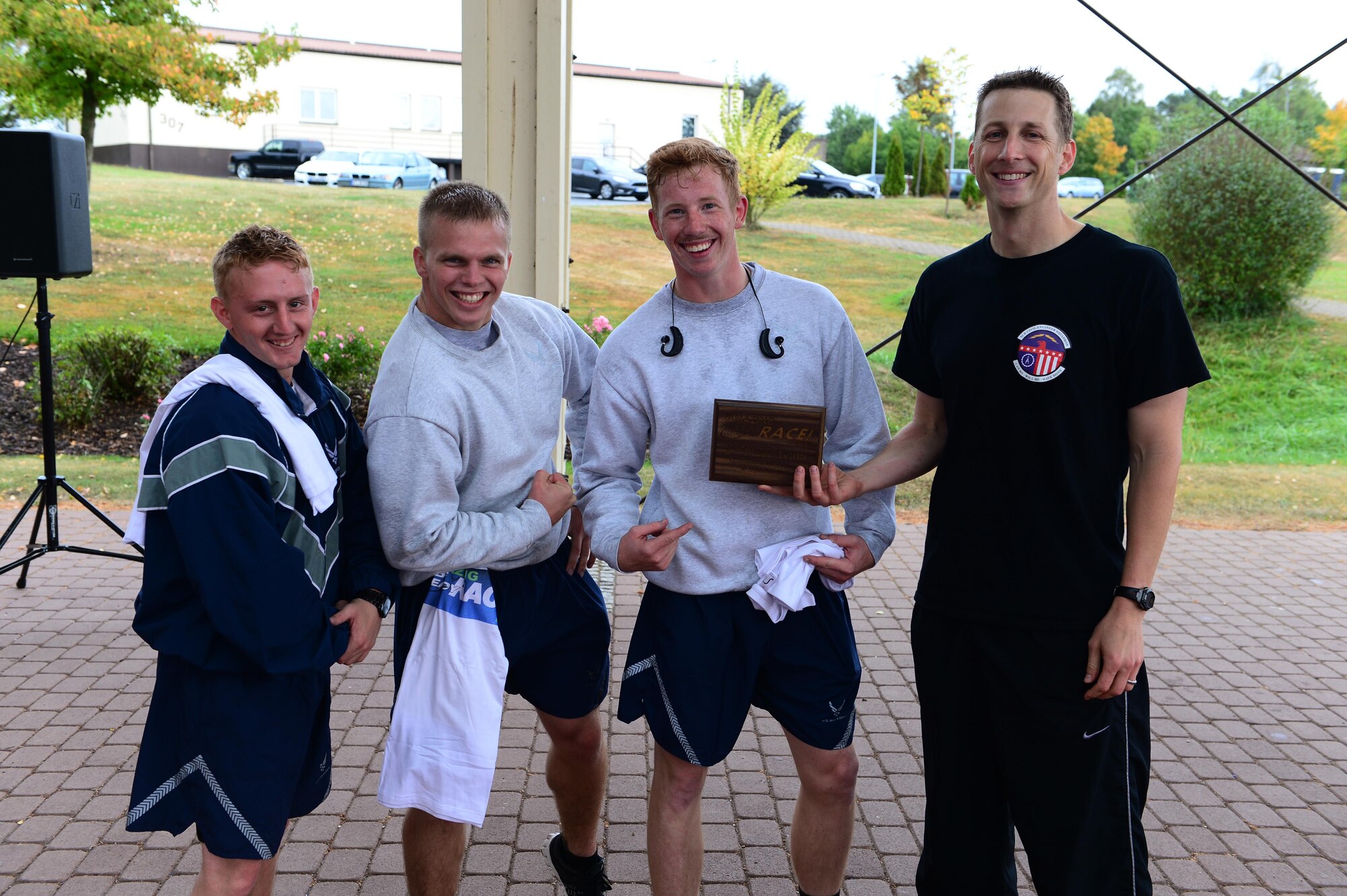 52nd Fighter Wing Airmen receive a plaque for winning second place in The Amazing Be Ready Race recognizing National Preparedness Month at Spangdahlem Air Base, Germany, Sept. 30, 2016. The race consisted of several stations challenging Airmen on their knowledge and readiness for emergency response and preparedness. (U.S. Air Force photo by Senior Airman Joshua R. M. Dewberry)