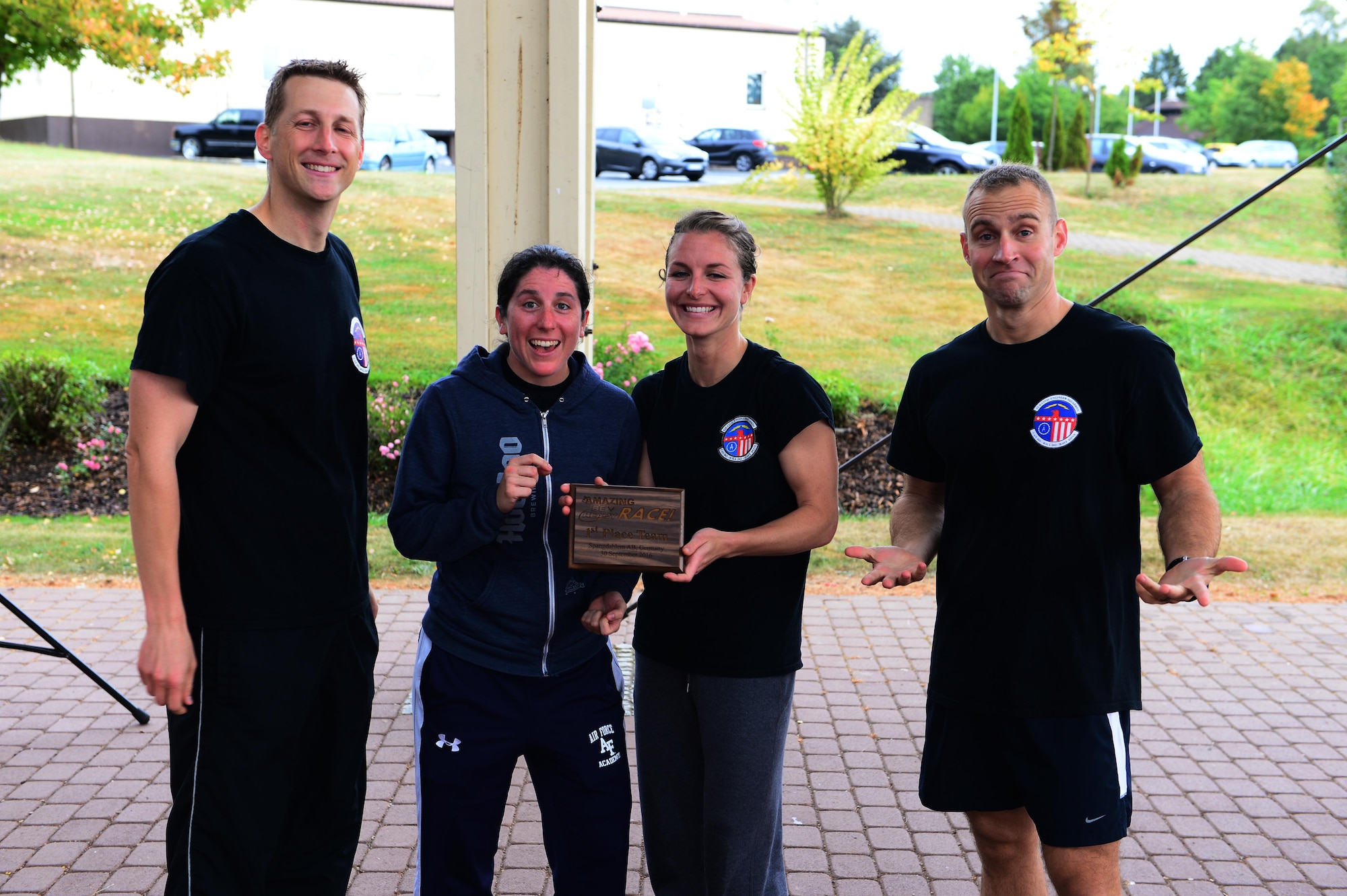 52nd Fighter Wing Airmen receive a plaque for winning The Amazing Be Ready Race recognizing National Preparedness Month at Spangdahlem Air Base, Germany, Sept. 30, 2016. The race consisted of several stations challenging Airmen on their knowledge and readiness for emergency response and preparedness. (U.S. Air Force photo by Senior Airman Joshua R. M. Dewberry)