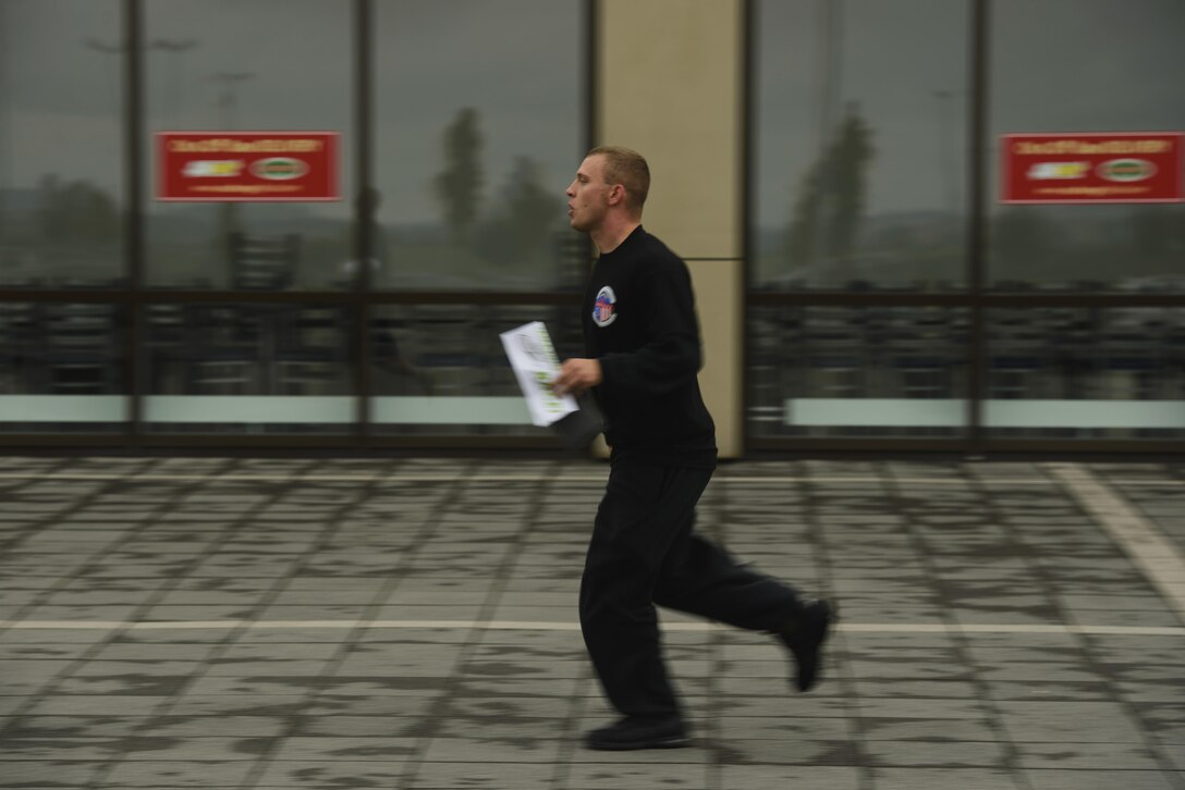 An Airman runs to the next checkpoint during an Amazing Race 5k event on Spangdahlem Air Base, Germany, Sept. 30, 2016. More than 100 Airmen participated in this event which emphasized emergency readiness. (U.S. Air Force photo by Staff Sgt. Jonathan Snyder)                              
