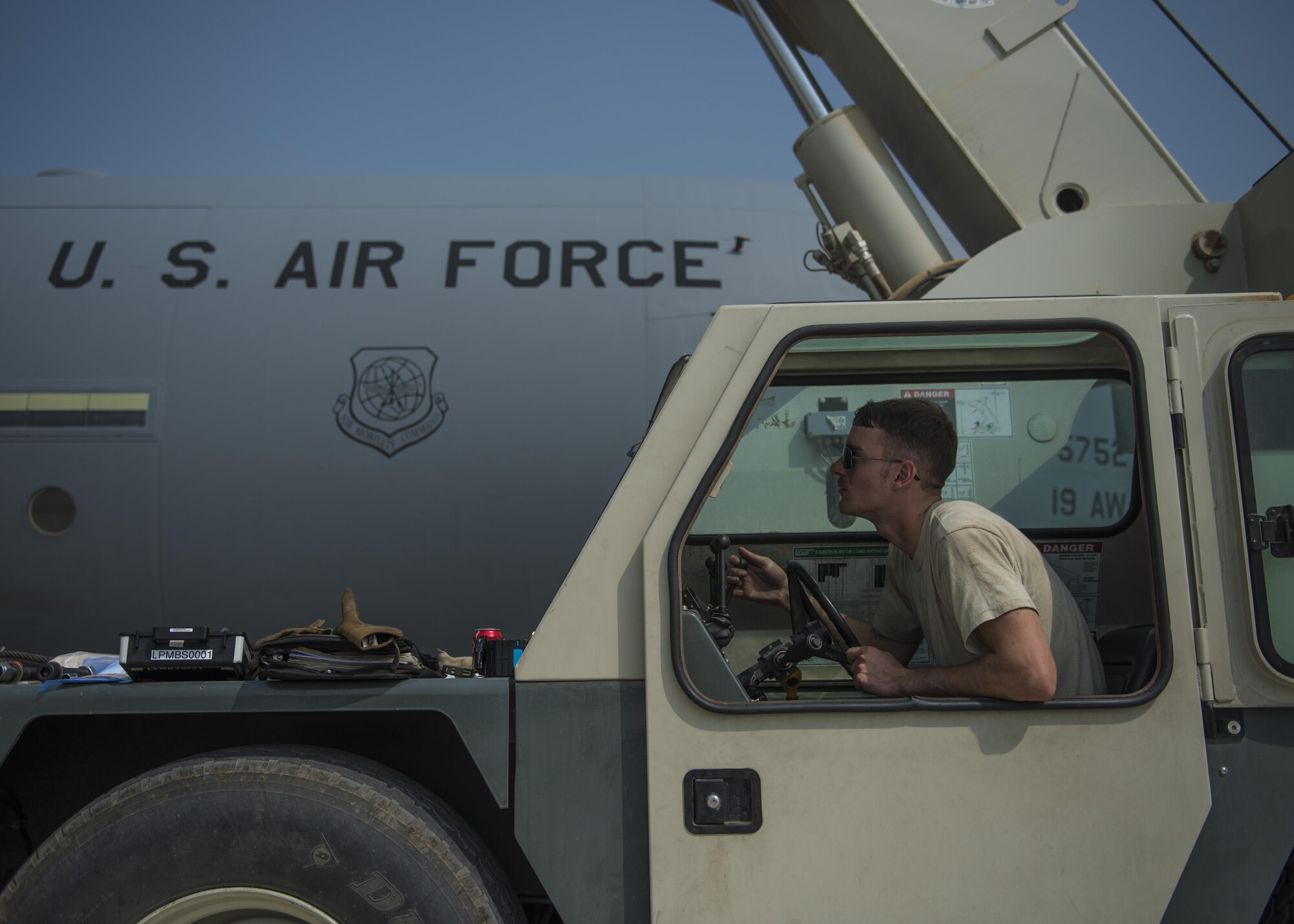 Senior Airman Zackery Schaadt, 455th Expeditionary Aircraft Maintenance Squadron engine mechanic, operates a crane to help install a new C-130J Super Hercules engine, Bagram Airfield, Afghanistan, Oct. 01, 2016. Members of the 455th Expeditionary Aircraft Maintenance Squadron ensure that aircraft at Bagram are prepared for flight and return them to a mission-ready state once they land. (U.S. Air Force photo by Senior Airman Justyn M. Freeman)