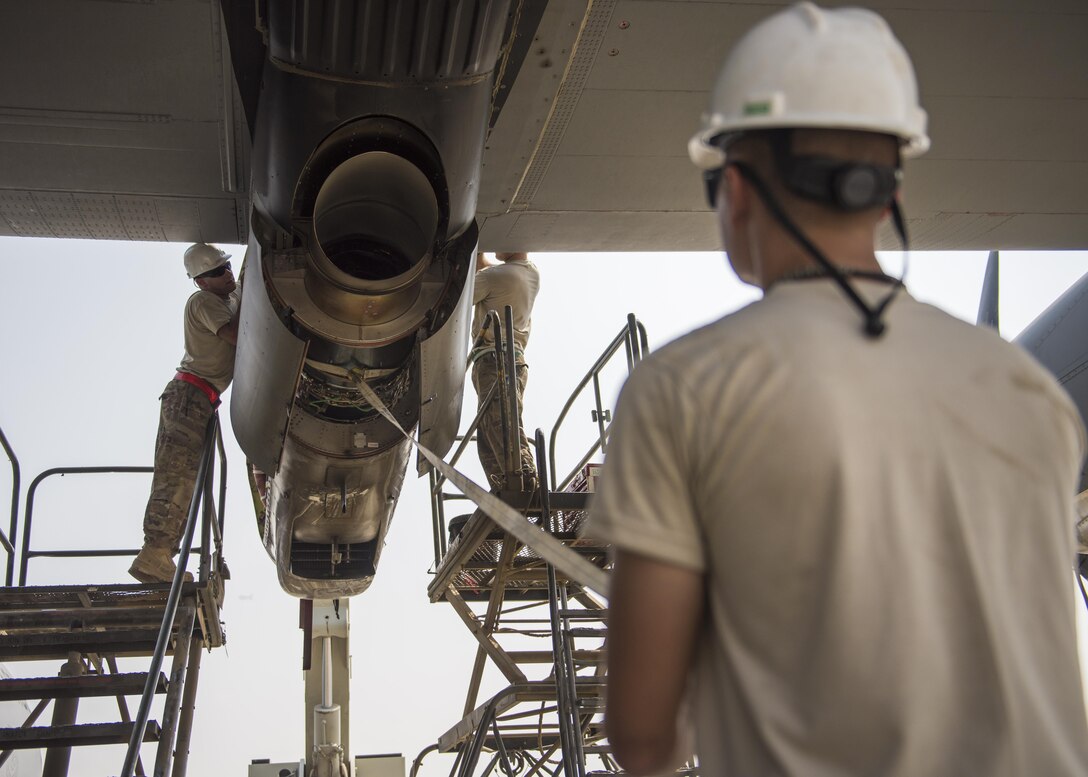 Senior Airman Thomas Budd (left) and Senior Airman Colbey Cox (right), 455th Expeditionary Aircraft Maintenance Squadron electrician, install a new C-130J Super Hercules engine, Bagram Airfield, Afghanistan, Oct. 01, 2016. The 455th EAMXS is responsible for repairing and maintaining military aircraft on Bagram, as well as performing preventative maintenance inspections. (U.S. Air Force photo by Senior Airman Justyn M. Freeman)