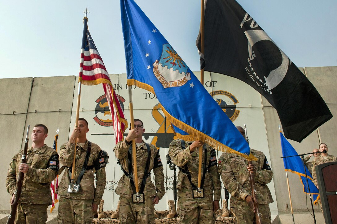 An Air Force honor guard presents the colors during a remembrance ceremony for six fallen airmen at Bagram Airfield, Afghanistan, Oct. 2, 2016. Six airmen and five contractors lost their lives when an aircraft crashed during takeoff at Jalalabad Airfield, Afghanistan, Oct. 2, 2015.
Air Force photo by Capt. Korey Fratini