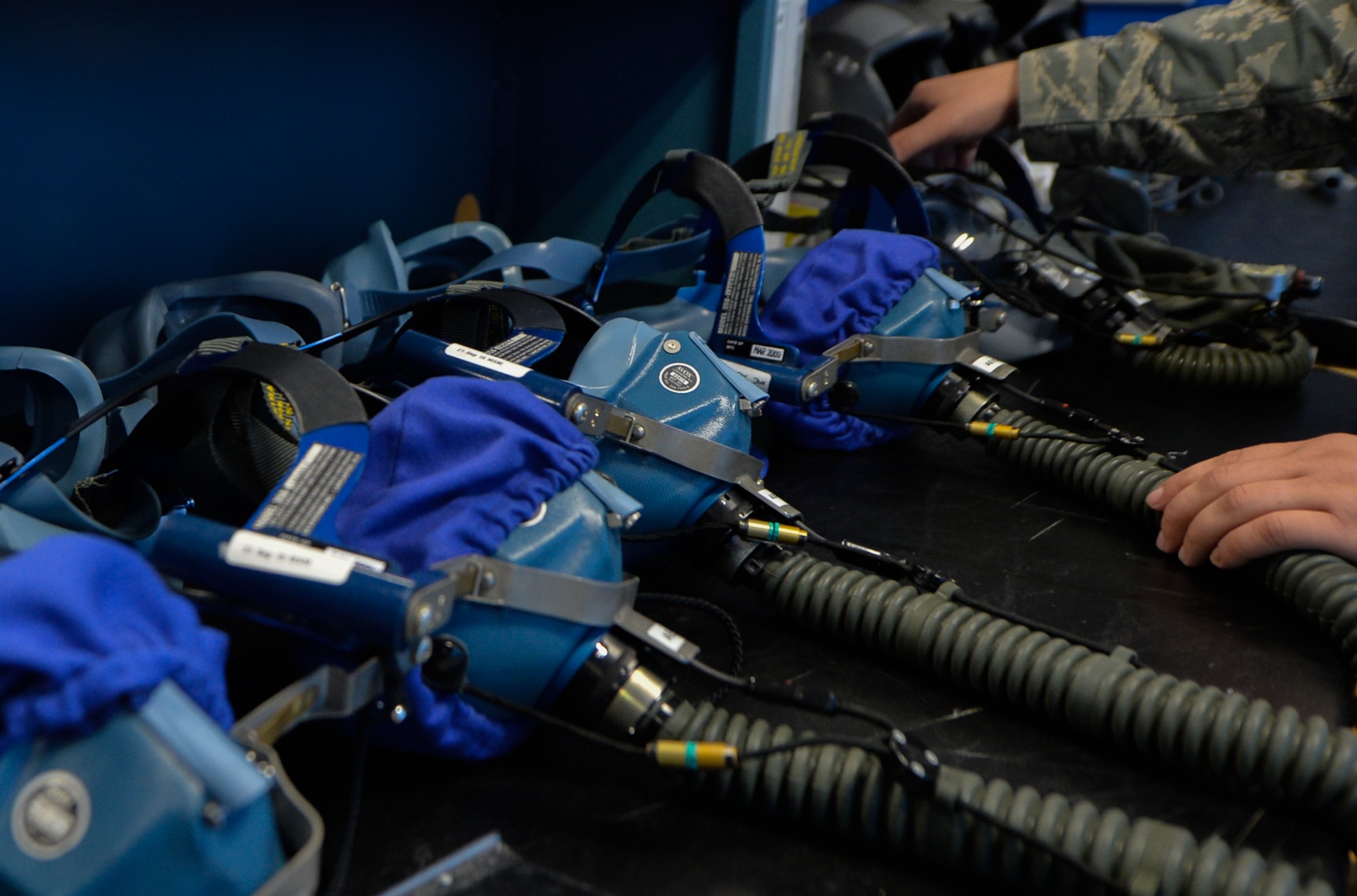 Tech Sgt. Haven Asche, 86th Operations Support Squadron air crew flight equipment NCO in charge, inspects a LL09 quick-don oxygen mask Sept. 20, 2016 at Ramstein Air Base, Germany. In addition to servicing flight equipment, AFEs instruct aircrew on its use and purpose. (U.S. Air Force photo/Senior Airman Nesha Humes)