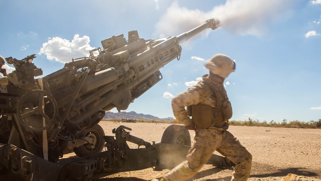 Cpl. Eduardo Osorionunez, a field artillery canoneer with 1st Battalion, 11th Marine Regiment, fires the M777 Howitzer during a CH-53 day battle drill exercise at Fire Base Burt, Calif., Oct. 1, 2016. The battle drill was part of Weapons and Tactics Instructor Course (WTI) 1-17, a seven week training event hosted by MAWTS-1 cadre which emphasizes operational integration of the six functions of Marine Corps aviation in support of a Marine Air Ground Task Force. MAWTS-1 provides standardized advanced tactical training and certification of unit instructor qualifications to support Marine aviation Training and Readiness and assists in developing and employing aviation weapons and tactics. 