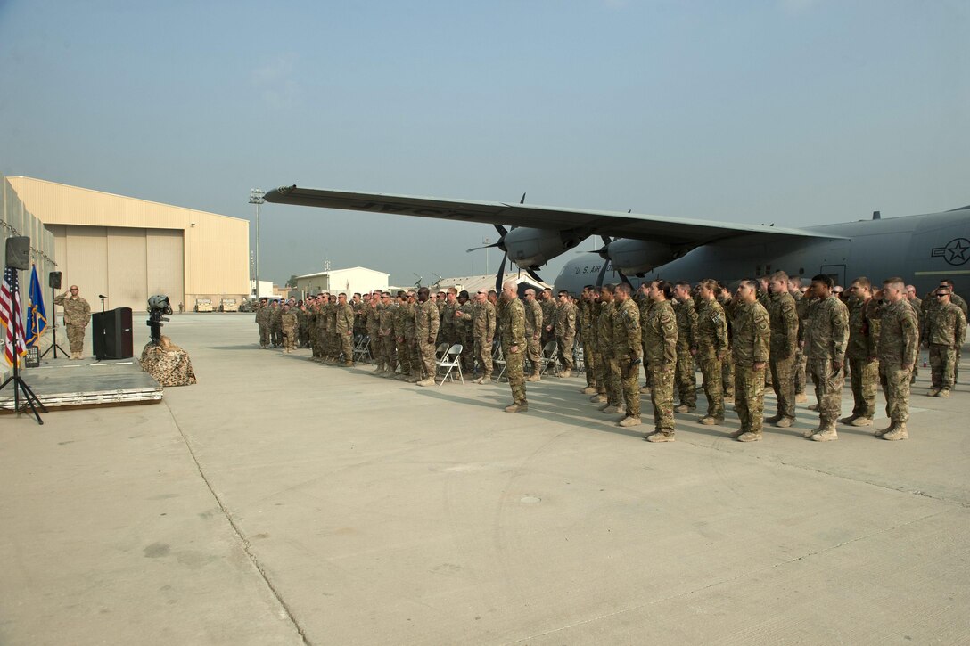 Airmen and soldiers render honors to the six airmen and civilians lost when TORQE 62 crashed one year ago during a remembrance ceremony at Bagram Airfield, Afghanistan, Oct. 2, 2016. Air Force photo by Capt. Korey Fratini