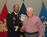 DLA Troop Support Commander Army Brig. Gen. Charles Hamilton, left, presents Stephen DiLizio, business process analyst, with a Vietnam War veteran pin to honor his service during the war at a Quarterly Awards ceremony Sept. 28.