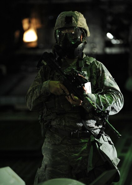 A member of the 509th Security Forces Squadron (SFS) secures Air Force resources on a C-17 Globemaster III during training at Whiteman Air Force Base, Mo., Sept. 20, 2016. The training increases readiness of 509th SFS Airmen. (U.S. Air Force photo by Senior Airman Danielle Quilla)