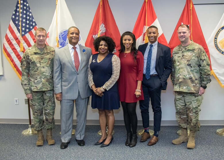The Booker family, flanked by TAD leadership following the Sept. 29 retirement ceremony held at TAD
Headquarters, Winchester, Va. TAD Commander Maj. Gen. Robert Carlson, Donn Booker Sr., Wilhelmenia, Marina and Donn Booker Jr., and Cmd. Sgt. Maj. Ronald Johnson.

