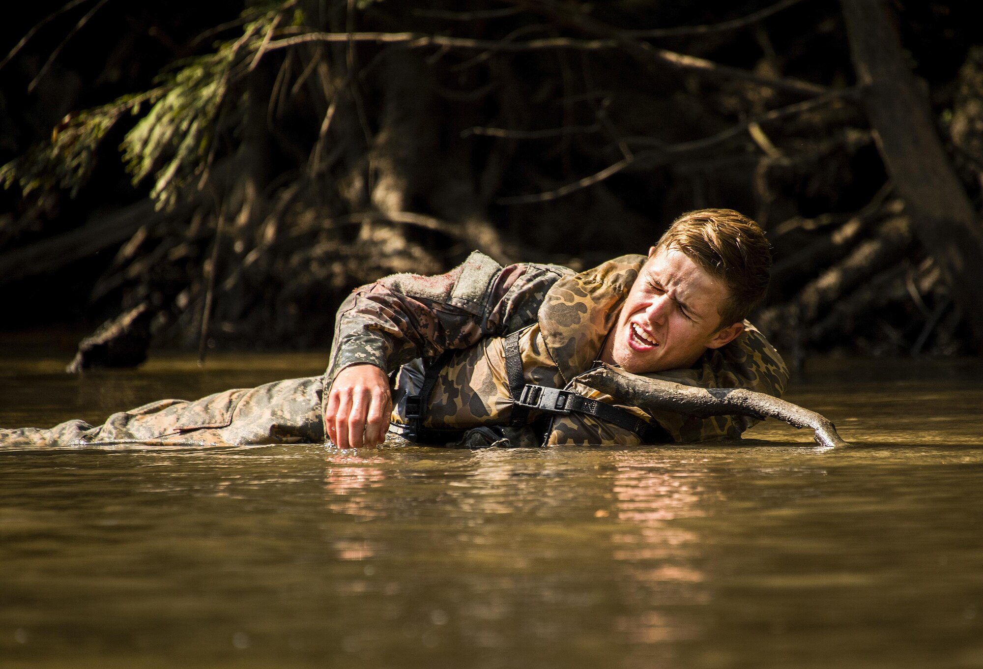 A simulated wounded 6th Ranger Training Battalion Soldier yells for help while lying in the river during a mass casualty exercise Sept. 28 at Eglin Air Force Base, Fla.  Three groups of Soldiers in zodiac boats encountered a simulated civilian and Army boat crash.  The Soldiers acted as first responders to triage the victims, coordinate to receive help and get the wounded to local emergency technicians.  (U.S. Air Force photo/Samuel King Jr.)