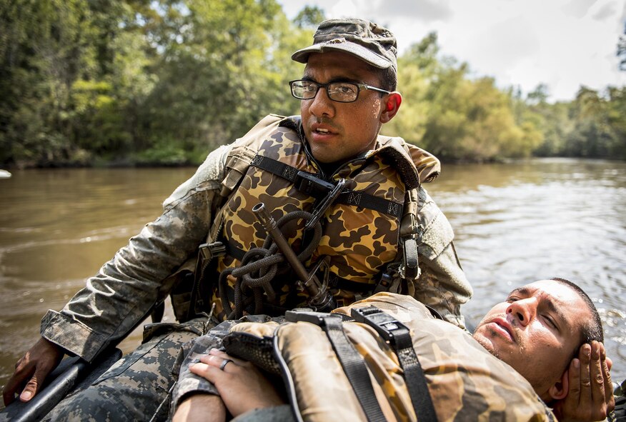 A 6th Ranger Training Battalion Soldier cares for a simulated victim during a mass casualty exercise Sept. 28 at Eglin Air Force Base, Fla.  Three groups of Soldiers in zodiac boats encountered a simulated civilian and Army boat crash.  The Soldiers acted as first responders to triage the victims, coordinate to receive help and get the wounded to local emergency technicians.  (U.S. Air Force photo/Samuel King Jr.)