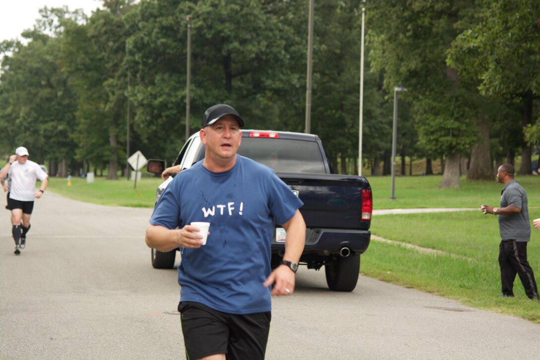 RICHMOND, Va. - Sgt. 1st Class David Mangan, chaplain assistant at the 80th Training Command (TASS), rounds his first lap of the Suicide Prevention Awareness 5K Fun Run/Walk at the Defense Supply Center held here on Sep. 28, 2016.  Hoping to get a few laughs, his shirt logo “WTF!” reads on the back “Where’s The Finish?” (Photo by Maj. Addie Randolph, 80th Training Command (TASS) Public Affairs)