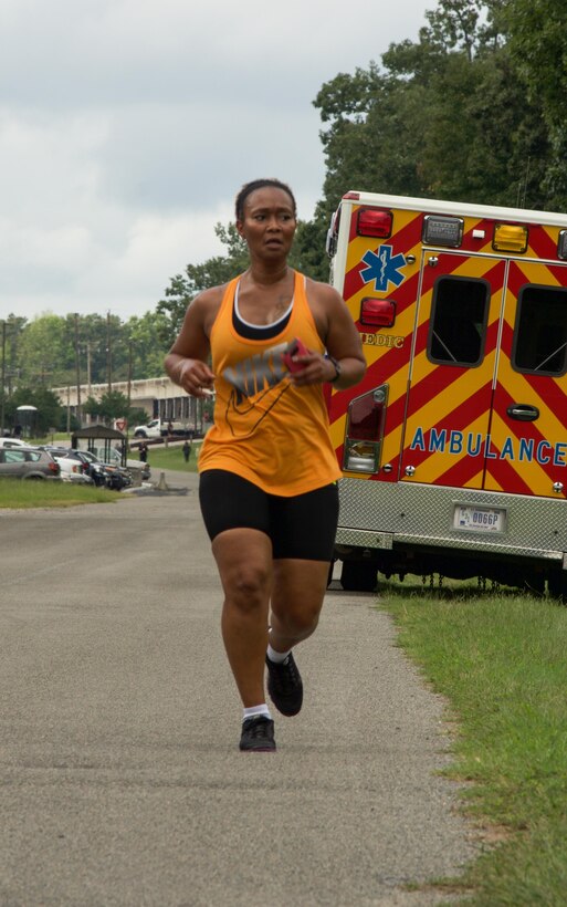 RICHMOND, Va. - Ms. Subretta Pompey, human resources specialist for the 80th Training Command (TASS), runs toward the finish line of the Suicide Prevention Awareness 5K Fun Run/Walk at the Defense Supply Center held here on Sep. 28, 2016. The 80th TC held the event for all Department of Defense employees and their families. (Photo by Maj. Addie Randolph, 80th Training Command (TASS) Public Affairs)