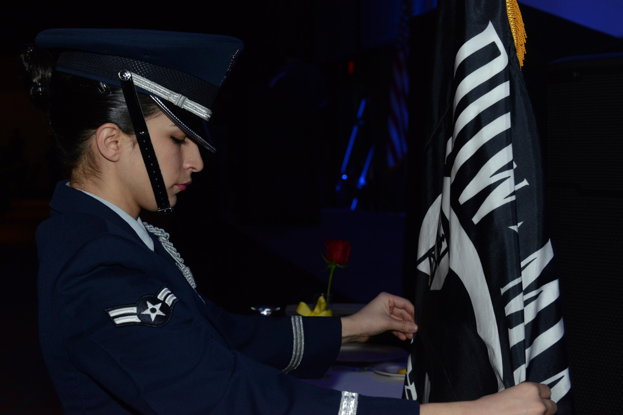 Airman 1st Class Tesla Saiz, Joint Base Elmendorf-Richardson honor guard, adjusts the Prisoners Of War/Missing In Action flag before the ceremony during the 2016 JBER Air Force Ball at the Anchorage Egan Center, Alaska, Sept. 24, 2016. This event marked the Air Force’s 69th birthday celebrating the Air Force’s heritage through reflection, ceremony and camaraderie.