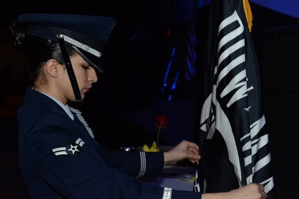 Airman 1st Class Tesla Saiz, Joint Base Elmendorf-Richardson honor guard, adjusts the Prisoners Of War/Missing In Action flag before the ceremony during the 2016 JBER Air Force Ball at the Anchorage Egan Center, Alaska, Sept. 24, 2016. This event marked the Air Force’s 69th birthday celebrating the Air Force’s heritage through reflection, ceremony and camaraderie.