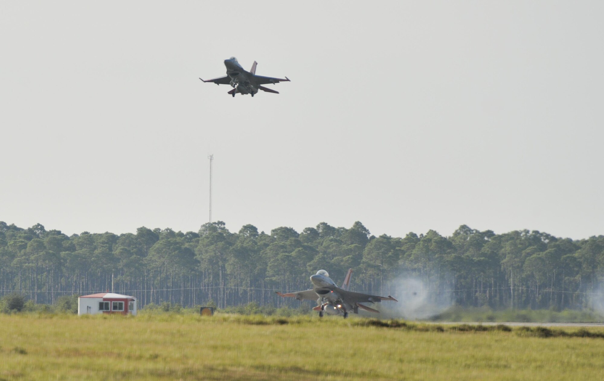 An unmanned QF-16 Full Scale Aerial Target from the 82nd Aerial Targets Squadron lands on an auxiliary runway at Tyndall Air Force Base, Fla., Sept. 29, 2016. The QF-16 is used by the 53rd Weapons Evaluation Group for unmanned aerial target training programs and data collection for the testing of weapon systems. (U.S. Air Force photo by Tech. Sgt. Javier Cruz/Released)