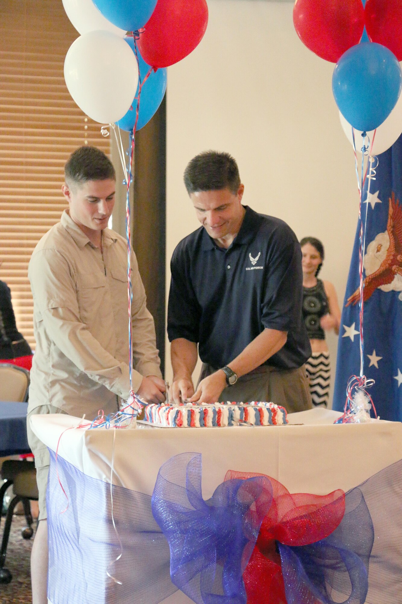 Second Lt. Thomas Julian and the AEDC Commander Col. Rodney Todaro cut the birthday cake during the Air Force Birthday Fair Sept. 16, 2016, at the Arnold Lakeside Center. The Air Force 69th birthday was Sept. 18. (U.S. Air Force photo/Emily Howell)