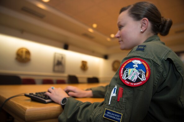 Capt. Victoria Fort, 90th Operational Support Squadron ICBM emergency war order planner, works at a computer station at F.E. Warren Air Force Base, Wyo., Sept. 20, 2016. Fort’s specialty is ensuring the ICBM targeting coordinates are correct before information is sent to the field. (U.S. Air Force photo by Staff Sgt. Christopher Ruano)