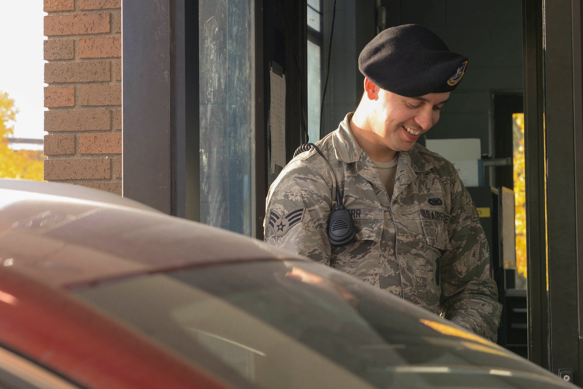 Senior Airman Tyler Serr, an installation entry controller assigned to the 5th Security Forces Squadron, hands back an ID at Minot Air Force Base, N.D., Sept. 30, 2016. Due to implementation of the READ ID Act, individuals are no longer able to access Minot AFB unescorted with only a state-issued identification card or driver’s license from Missouri, Minnesota, Washington or American Samoa. (U.S. Air Force photo/Airman 1st Class Jessica Weissman)