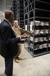 Kevin Bettis, Mapping Division chief, Customer Operations Directorate, Defense Logistics Agency Aviation, speaks with Army Staff Sgt. Jeremiah Saunders, from the 83rd Civil Affairs Battalion, about mapping capabilities at the new Army Forces Command Intelligence Readiness Operations Center at Fort Bragg, North Carolina, during an open house Sept. 28, 2016. 

