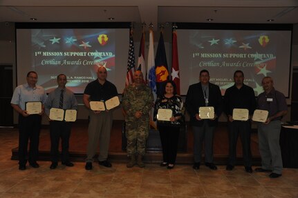 The following 1st MSC employees received a performance award for performing in a superior manner which exceeded their job requirements:
Mr. Richard Garcia (Left)
Mr. Humberto Ferrer Lopez
Mr. Hector Agosto
Ms. Elsa F. Cortes
Mr. Carlos J. Alvarado
Mr. Carlos E. Olivero
Mr. Ange R. Rodriguez (Right)

The awards were handed by Brig. Gen. Alberto C. Rosende, commanding general of the 1st MSC, in Ramos Hall at Fort Buchanan, Puerto Rico on September 29.