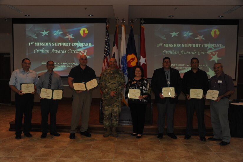 The following 1st MSC employees received a performance award for performing in a superior manner which exceeded their job requirements:
Mr. Richard Garcia (Left)
Mr. Humberto Ferrer Lopez
Mr. Hector Agosto
Ms. Elsa F. Cortes
Mr. Carlos J. Alvarado
Mr. Carlos E. Olivero
Mr. Ange R. Rodriguez (Right)

The awards were handed by Brig. Gen. Alberto C. Rosende, commanding general of the 1st MSC, in Ramos Hall at Fort Buchanan, Puerto Rico on September 29.