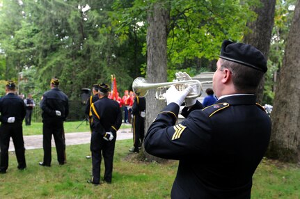 FREMONT, Ohio (October 2, 2016) – Playing Taps is a tradition at many military memorials. Here, Sgt. Marty Maggart, bugler, 338th Army Band, 88th Regional Support Command, plays the traditional song during the wreath-laying ceremony for President Rutherford B. Hayes, the 19th President of the United States, in Fremont, Ohio, October 2.