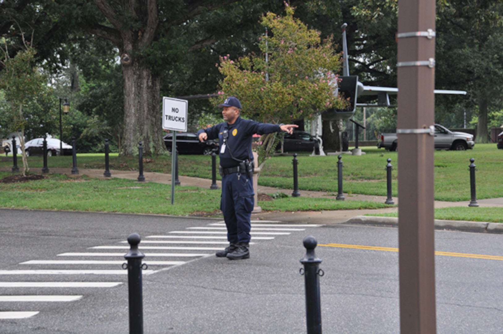 Sgt. Aubrey Parker, Defense Logistics Agency Installation Support at Richmond, Virginia police officer, directs traffic while Fire and Emergency Services responds to a medical event Sept. 20, 2016. 