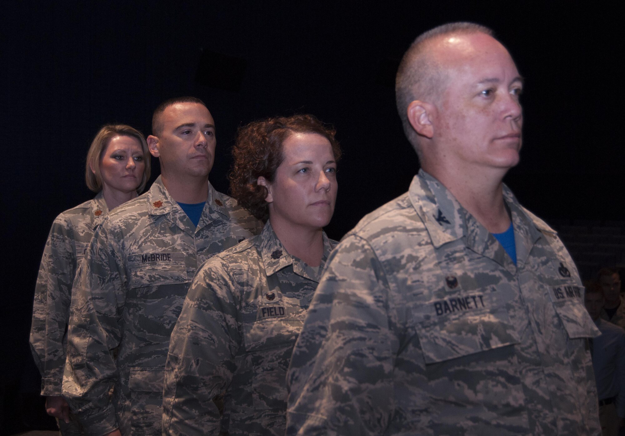 In a dual change of command ceremony at the base theater the 73rd Aerial Port Squadron and 301st Logistics Readiness Squadron welcome new commanders Sunday, Oct. 3 at Naval Air Station Fort Worth Joint Reserve Base, Texas. Lt. Col. Gloria Field relinquished command of the 73rd APS to Maj. Patrick McBride and Maj. Brandi Collen gave command of the 301st LRS to Field. Col. Jeffery Barnett, 301st Mission Support Group commander, presided over the ceremony. (U.S. Air Force photo by Senior Airman Jeromie Cano)                                                                                           