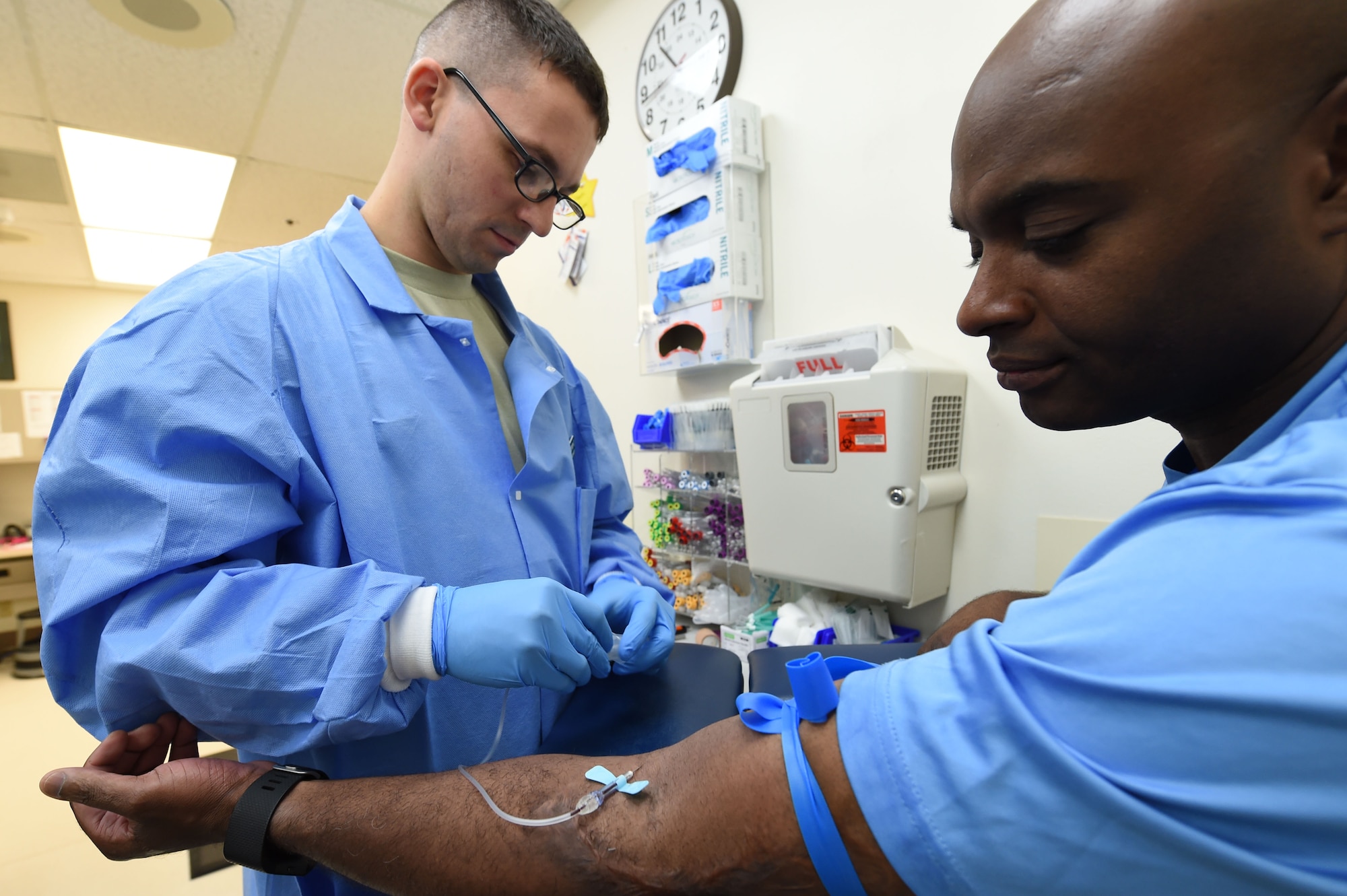 Staff Sgt. Donald Chapman, 359th Clinical Laboratory and Radiology Flight medical lab technician, draws a blood sample from a patient at the 359th Medical Group lab at Joint Base San Antonio-Randolph, Texas, Sept. 16, 2016. Regular blood samples, and those ordered by a primary care manager, ensure the health of all military members, dependents, and retirees. (U.S. Air Force photo/Tech. Sgt. Christopher Carwile/Released)