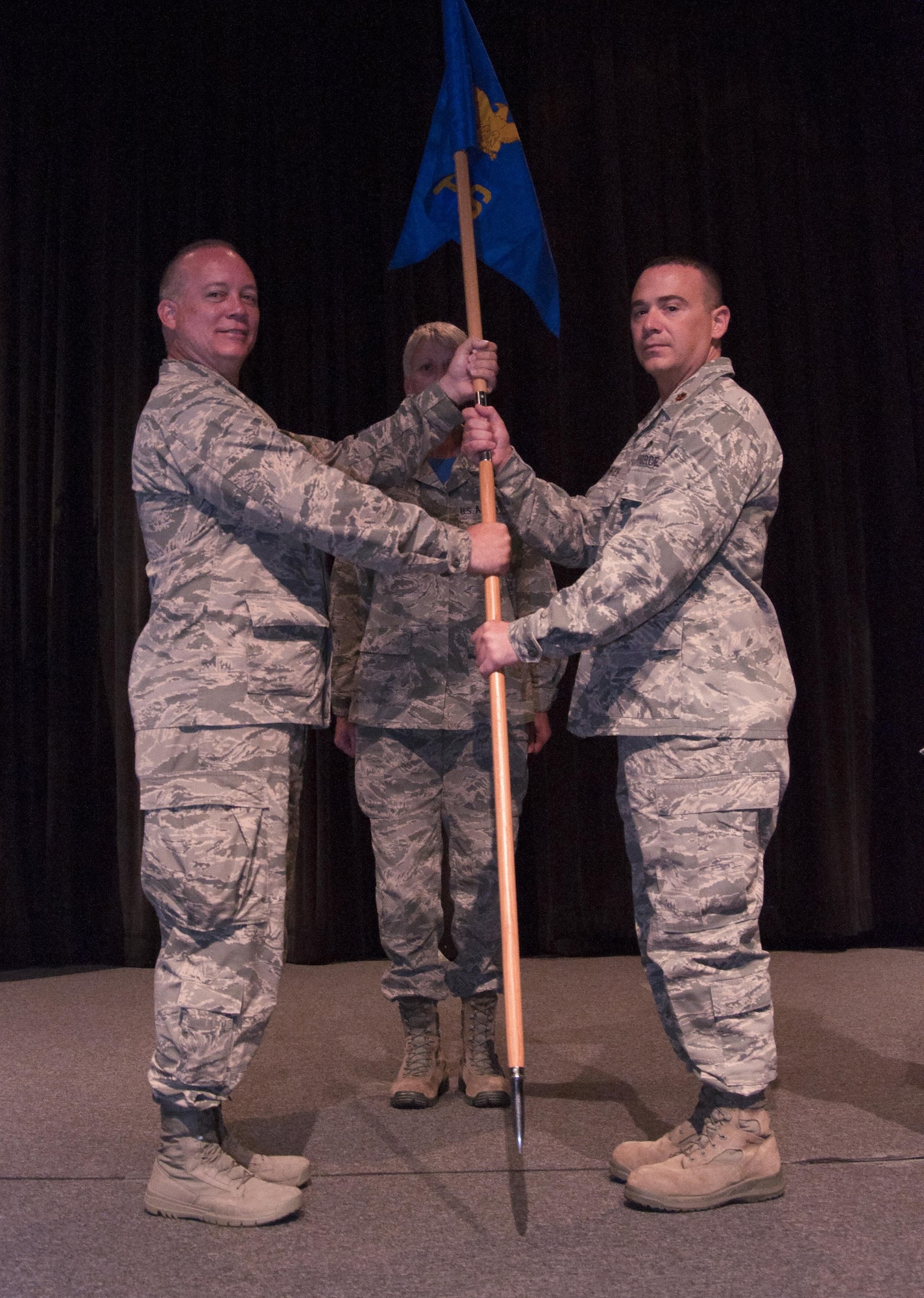 Maj. Patrick McBride takes command of the 73rd Aerial Port Squadron in a change of command ceremony at the base theater Sunday, Oct. 3 at Naval Air Station Fort Worth Joint Reserve Base, Texas. Col. Jeffery Barnett, 301st Mission Support Group commander, presided over the ceremony. (U.S. Air Force photo by Senior Airman Jeromie Cano)