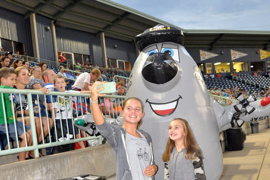 NILES, Ohio – The Air Force Reserve’s 910th Airlift Wing’s mascot, Winger, based at nearby Youngstown Air Reserve Station, Ohio, pauses to take a selfie with some fans at a Mahoning Valley Scrappers minor league baseball game at Eastwood Field here, August 10, 2016. A large group of the 910th Airlift Wing’s Citizen Airmen along with their families, friends and co-workers were in attendance and representatives from the 910th, also based at YARS, were involved in many game night activities for the annual YARS Night Out event where the Cleveland Indians Class A affiliate Scrappers beat the Batavia Muckdogs, 8-4. (U.S. Air Force photo/Maj. Polly Orcutt)
