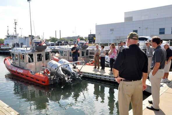 PORT OF CLEVELAND, Ohio – Seaman Vincent Hostoffer, a U.S. Coast Guardsman assigned to the USCG station here, talks with a group of attendees during the 4th Annual Joint Employer Awareness Event about a 25-foot Response Boat Small Class, or RB-S, here Aug. 11, 2016. The two-day event, designed to give civilian employers of Reservists and National Guardsmen a better understanding of the mission their employees carry out as members of the U.S. Armed Forces, also gave attendees the opportunity to get an up-close look at the Coast Guard Station here, the nearby U.S.S. Cod World War II Navy Submarine memorial and the 910th Airlift Wing's facilities at Youngstown Air Reserve Station, Ohio. (U.S. Air Force photo/Master Sgt. Bob Barko Jr.)