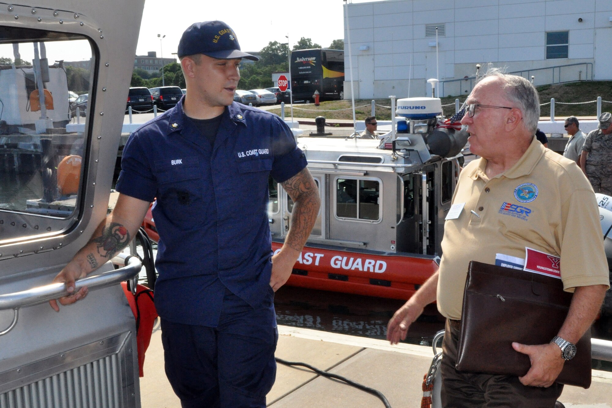 PORT OF CLEVELAND, Ohio – Petty Officer 3rd Class Anthony Burk, a U.S. Coast Guardsman assigned to the USCG station here, talks with John Marino, Ohio employer Support of the Guard and Reserve Military Outreach Coordinator, aboard a 25-foot Response Boat Small Class, or RB-S, during the 4th Annual Joint Employer Awareness Event here, Aug. 11, 2016. The two-day event, designed to give civilian employers of Reservists and National Guardsmen a better understanding of the mission their employees carry out as members of the U.S. Armed Forces, also gave attendees the opportunity to get an up-close look at the Coast Guard Station here, the nearby U.S.S. Cod World War II Navy Submarine memorial and the 910th Airlift Wing's facilities at Youngstown Air Reserve Station, Ohio. (U.S. Air Force photo/Master Sgt. Bob Barko Jr.)
