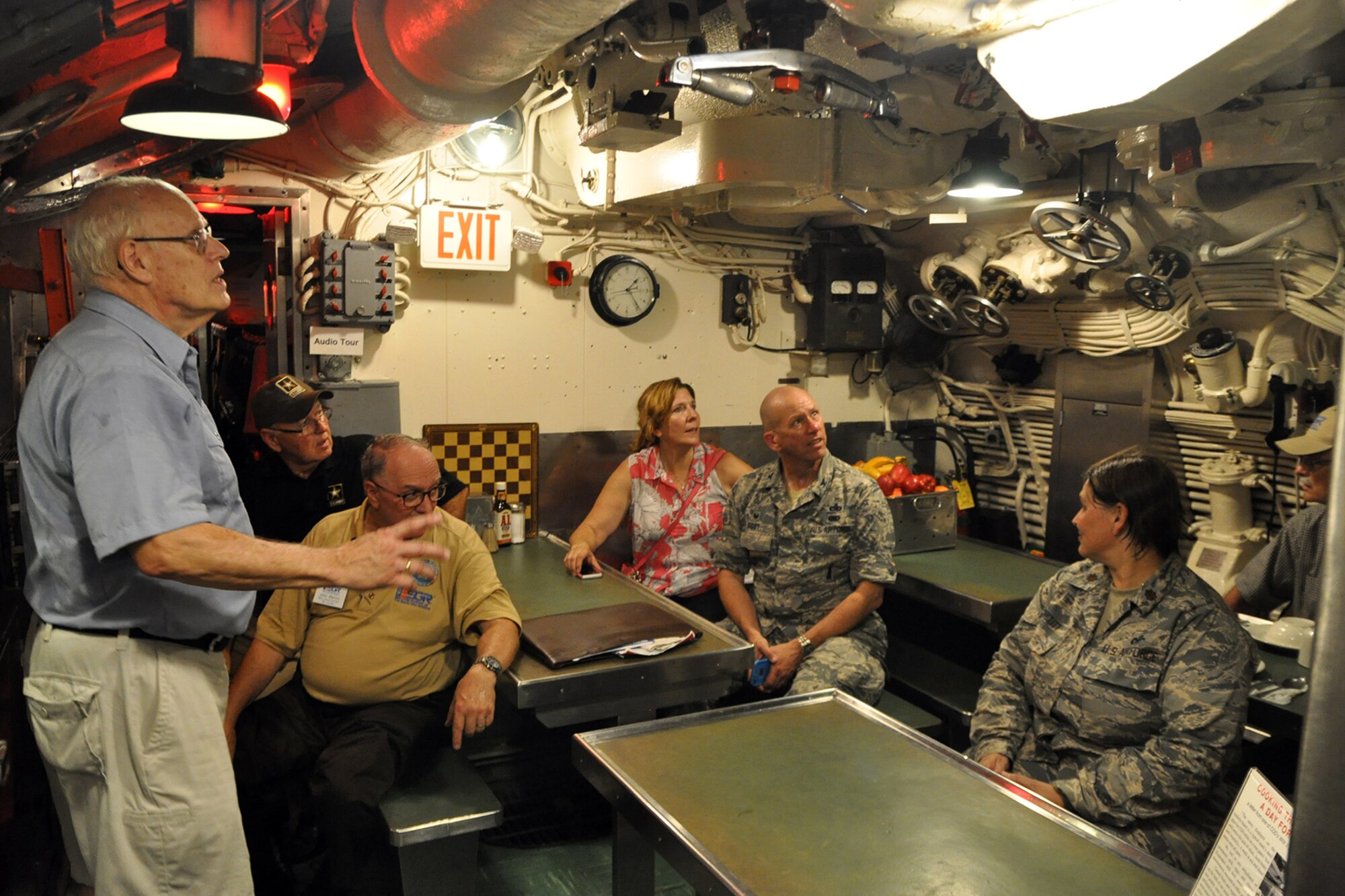 PORT OF CLEVELAND, Ohio – U.S.S. Cod Navy Submarine Memorial volunteer Ron Hoffman, a retired member of the Ohio Air National Guard, talks with a group of attendees, aboard the World War II vessel during the 4th Annual Joint Employer Awareness Event here, Aug. 11, 2016. The two-day event, designed to give civilian employers of Reservists and National Guardsmen a better understanding of the mission their employees carry out as members of the U.S. Armed Forces, also gave attendees the opportunity to get an up-close look at the nearby U.S. Coast Guard Station here, the nearby submarine memorial and the 910th Airlift Wing's facilities at Youngstown Air Reserve Station, Ohio. (U.S. Air Force photo/Master Sgt. Bob Barko Jr.)