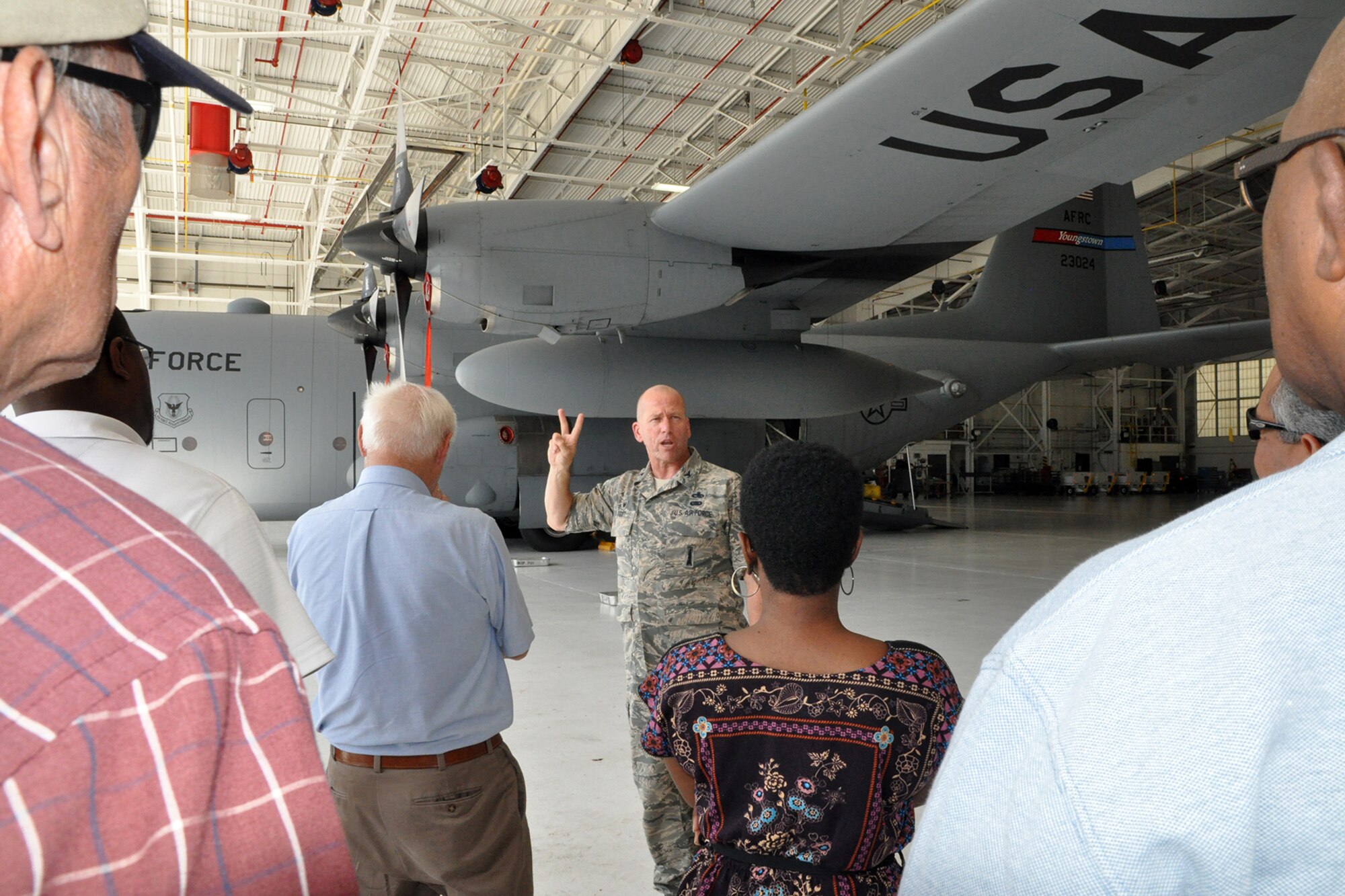 YOUNGSTOWN AIR RESERVE STATION, Ohio – Air Force Reserve Col. Davis Post, 910th Maintenance Group commander, talks about a C-130H Hercules tactical cargo transport aircraft with a group of attendees during the 4th Annual Joint Employer Awareness Event here, Aug. 12, 2016. The two-day event, designed to give civilian employers of Reservists and National Guardsmen a better understanding of the mission their employees carry out as members of the U.S. Armed Forces, also gave attendees the opportunity to get an up-close look at the U.S. Coast Guard Station and U.S.S. Cod World War II Navy Submarine memorial at the Port of Cleveland as well as the 910th Airlift Wing's facilities here. (U.S. Air Force photo/Master Sgt. Bob Barko Jr.)
