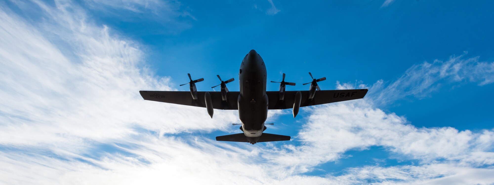 A modified C-130 Hercules soars overhead as it prepares to spray herbicide at the Saylor Creek
Training Range, Idaho, Sept. 17, 2016. Two prongs located in its mid-section emit a mixture of water and herbicides to spray large areas. (U.S. Air Force photo by Senior Airman Connor J. Marth/Released)