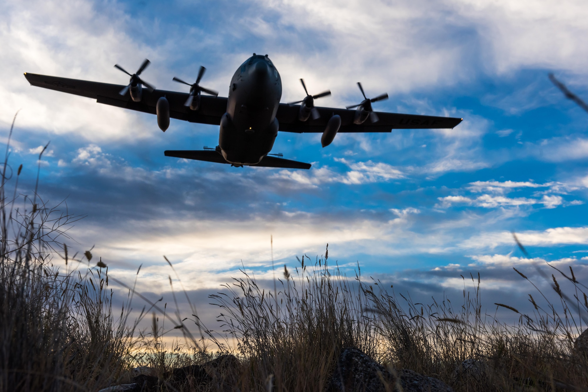 A modified C-130 Hercules soars overhead as it prepares to spray herbicide at the Saylor Creek
Training Range, Idaho, Sept. 17, 2016. The aircraft, from the 910th Airlift Wing, flys only 100 feet above the ground to spray aerial herbicide. (U.S. Air Force photo by Senior Airman Connor J. Marth/Released)