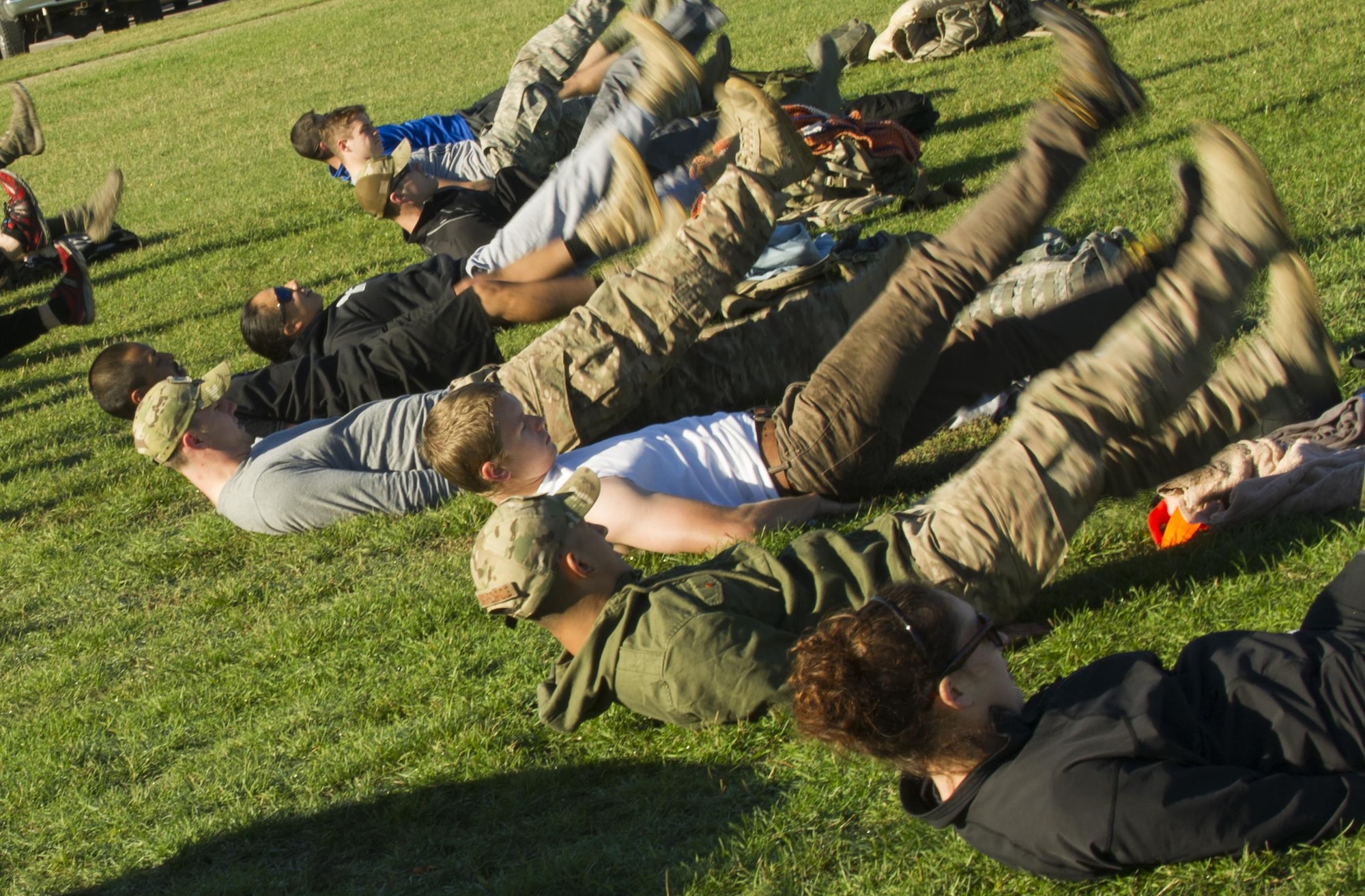 Airmen do flutter-kicks during the GoRuck Team Cohesion Challenge at Minot Air Force Base, N.D., Sept. 29, 2016. This was the third annual year the base has hosted the event. (U.S. Air Force photo/Senior Airman Apryl Hall)