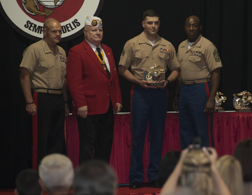 U.S. Marine Corps Sgt. Joshua Sherman receives the Gunnery Sgt. Carlos N. Hathcock II award by Gen. Robert Neller, Commandant of the Marine Corps, Richard Gore, National Commandant of the Marine Corps League and Sgt. Maj. of the Marine Corps Ronald Green, at the 34th annual United States Marine Corps’ Enlisted Awards Parade and Presentation on Marine Corps Base Quantico, Va., Sept. 28, 2016. The Marine Corps Enlisted Awards Presentation is held to recognize individual achievements of enlisted Marines throughout the Marine Corps. (U.S. Marine Corps photo by Pfc. Brian Domzalski)