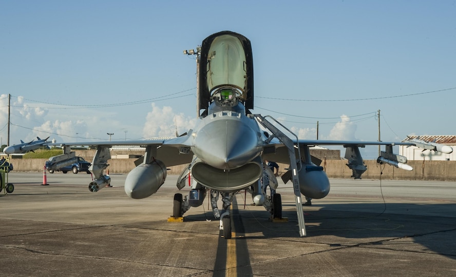 M151 warhead rounds integrated with the Advanced Precision Kill Weapon System II are loaded on an F-16 ahead of a July test mission on Eglin Air Force Base, Fla. The system turns existing Hydra 70 unguided rockets into precision guided munitions through the addition of a laser guidance kit. The Arizona Air National Guard Air Reserve Test Center worked with the 96th Test Wing community on the tests. (Courtesy Photo)