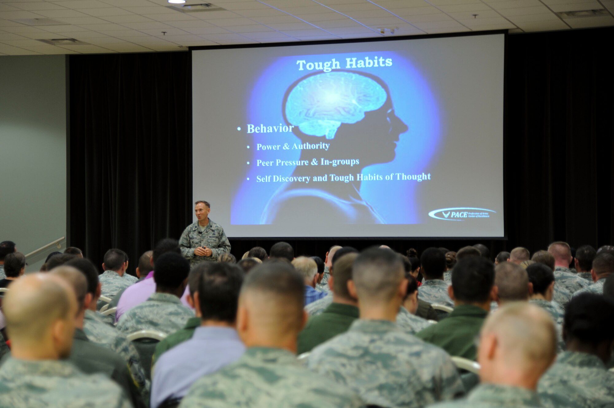 U.S. Air Force Lt. Col. Trevor Rosenberg, Air Education and Training Command Profession of Arms Center of Excellence leadership advisor, discusses habits with Airmen and civilians during the PACE Professionalism -- Enhancing Human Capital course Sept. 29, 2016, at the Walters Community Center on Little Rock Air Force Base, Ark. The course was available for two days to all active-duty personnel, civilians and spouses. (U. S. Air Force photo by Senior Airman Stephanie Serrano)