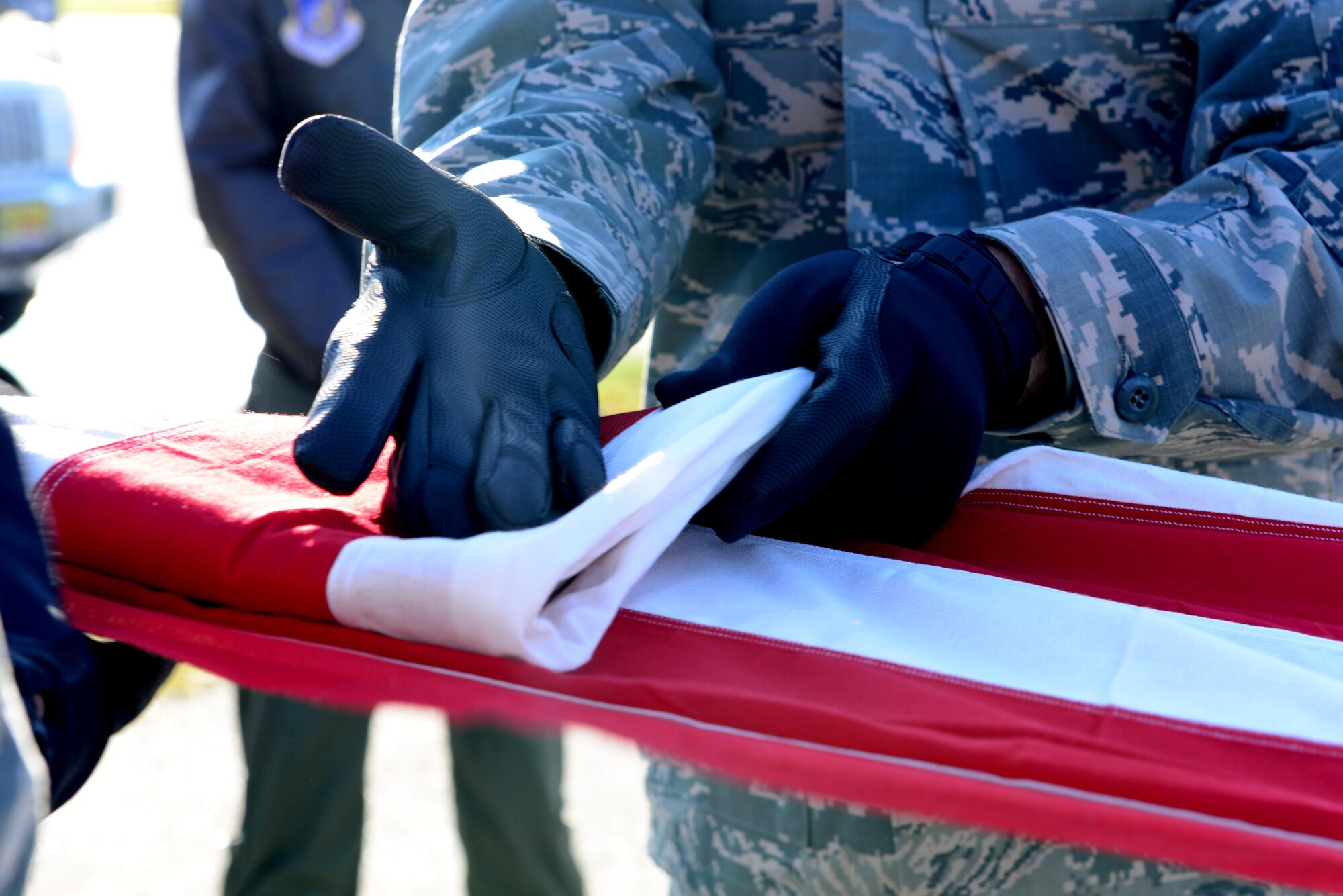 A member of the Eielson Honor Guard folds a flag Sept. 26, 2016, at Eielson Air Force Base, Alaska. The Honor Guard conducted a mock funeral detail to show commanders and squadron leadership the process. (U.S. Air Force photo by Airman 1st Class Cassandra Whitman)