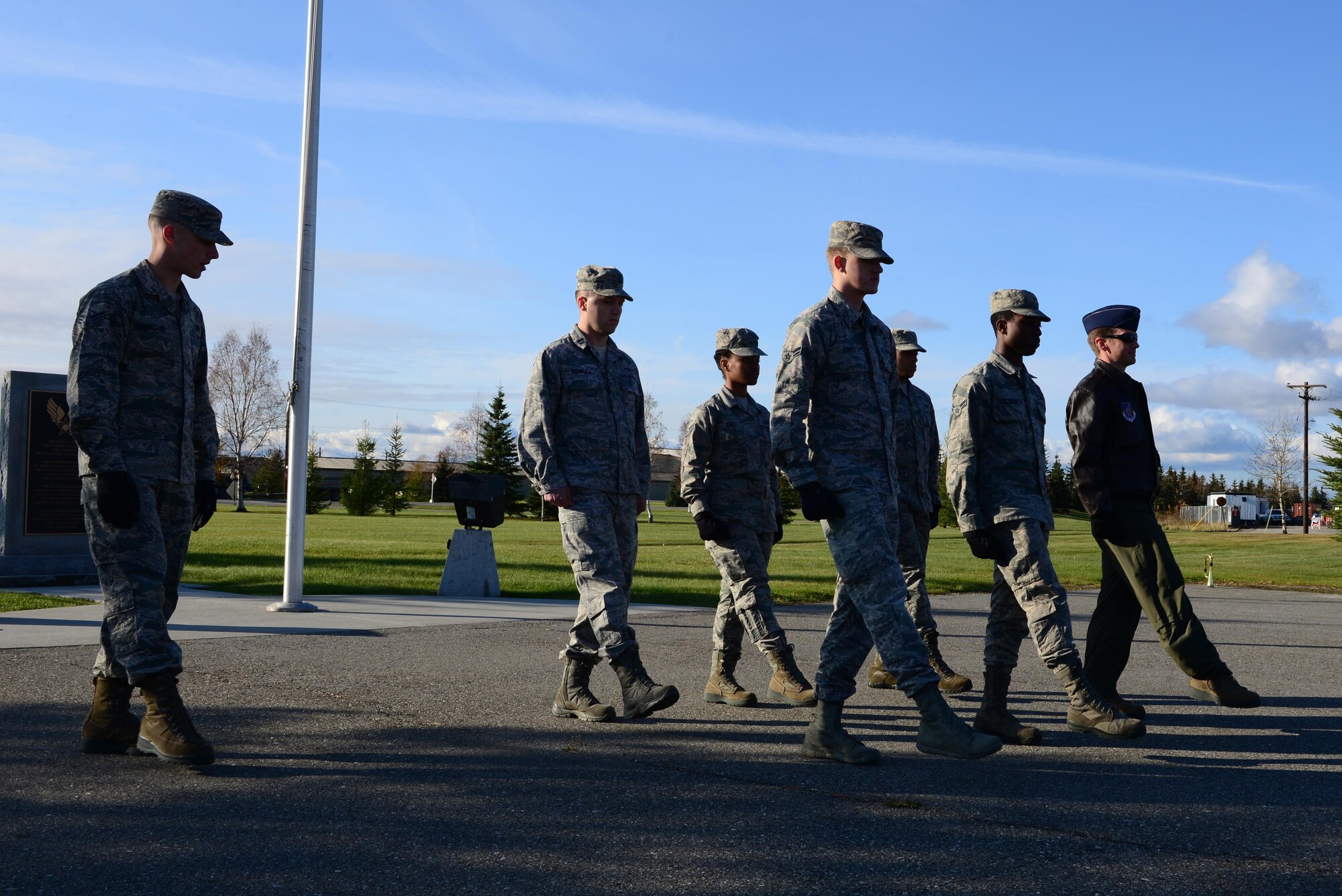 Members of the Eielson Honor Guard and 354th Fighter Wing leadership practice how to properly step to a casket during a military funeral detail Sept. 26, 2016, at Eielson Air Force Base, Alaska. The Honor Guard set up three stations to teach participating leadership different components of a funeral detail. (U.S. Air Force photo by Airman 1st Class Cassandra Whitman)